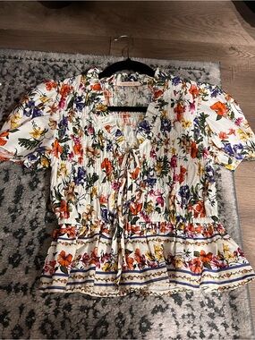 Olivaceous White Floral Smocked Tie-Front Peplum Top with Multicolor Blooms